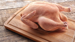 Raw turkey on cutting board