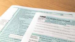 A US 1040 tax form on a table